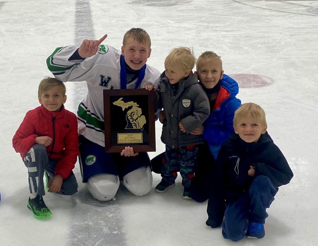 Dr. William Thompson family. He is pictured in his hockey uniform on the ice